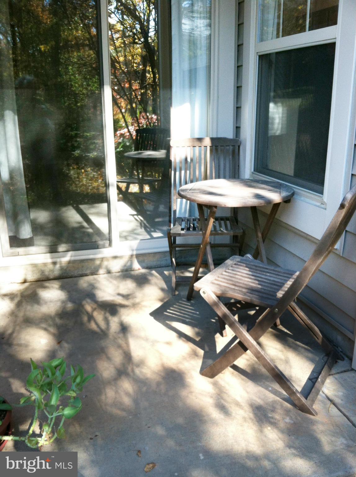 1785 Jonathan Way, Unit B Reston, VA 20190 - Photo 11 of 26 a view of a backyard with table and chairs