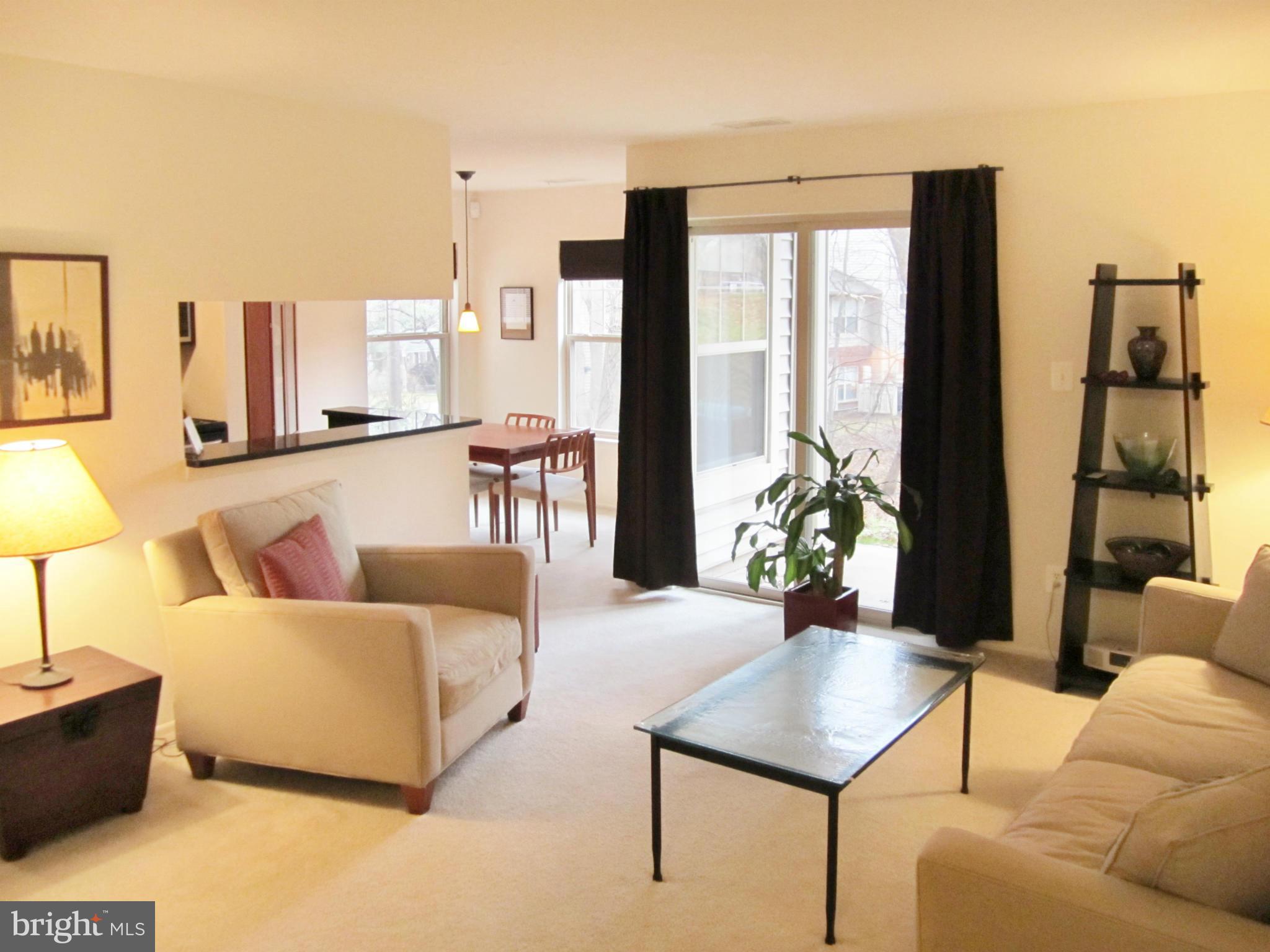 1785 Jonathan Way, Unit B Reston, VA 20190 - Photo 4 of 26 a living room with furniture and a large window