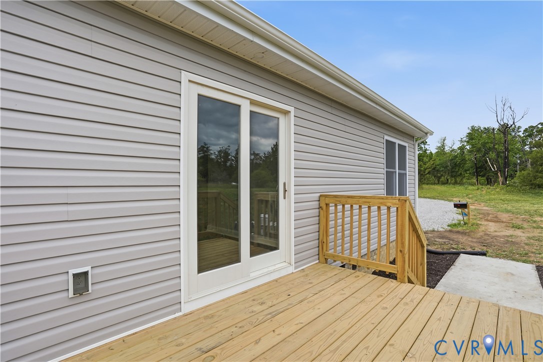 7839 King William Road Aylett, VA 23009 - Photo 30 of 38 a view of backyard with barbeque grill and wooden floor