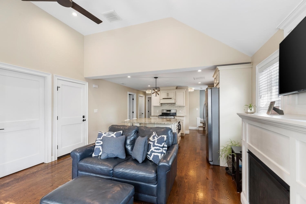 23 Locust Street, Unit 2 Danvers, MA 01923 - Photo 13 of 32 a living room with furniture and a flat screen tv