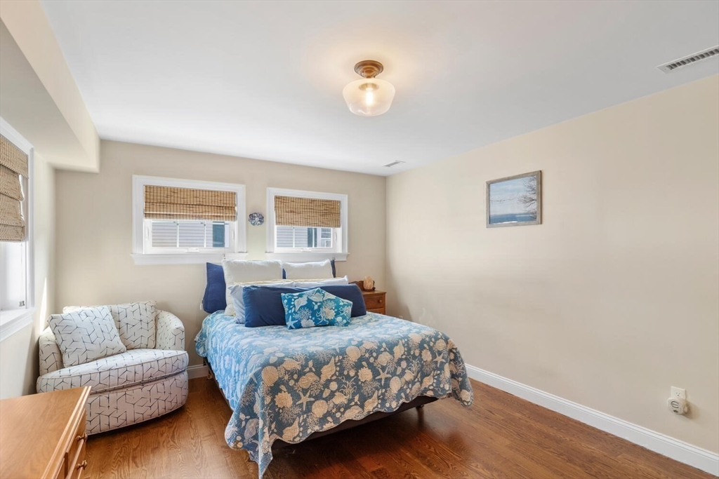23 Locust Street, Unit 2 Danvers, MA 01923 - Photo 18 of 32 a bedroom with a large bed and a window