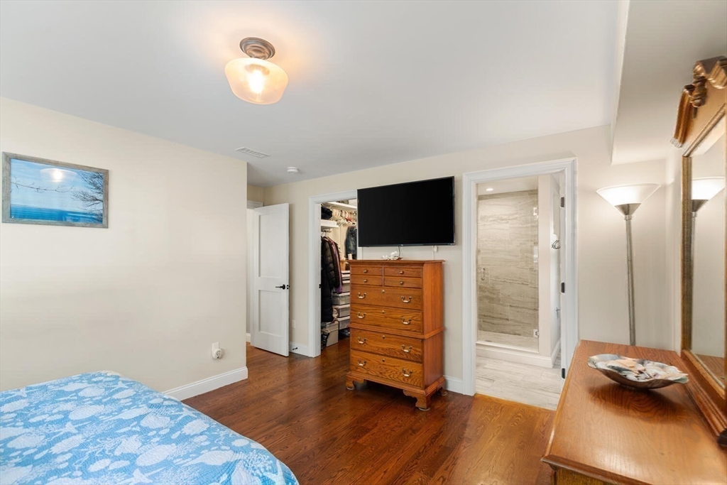 23 Locust Street, Unit 2 Danvers, MA 01923 - Photo 19 of 32 a view of room with wooden floor and window