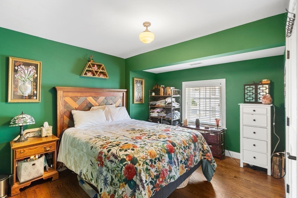 23 Locust Street, Unit 2 Danvers, MA 01923 - Photo 21 of 32 a bedroom with a bed and a dresser