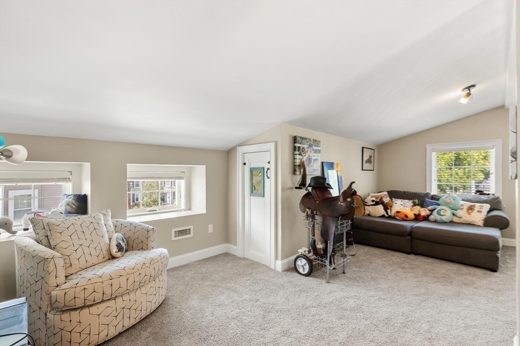 23 Locust Street, Unit 2 Danvers, MA 01923 - Photo 28 of 32 a living room with furniture and a window