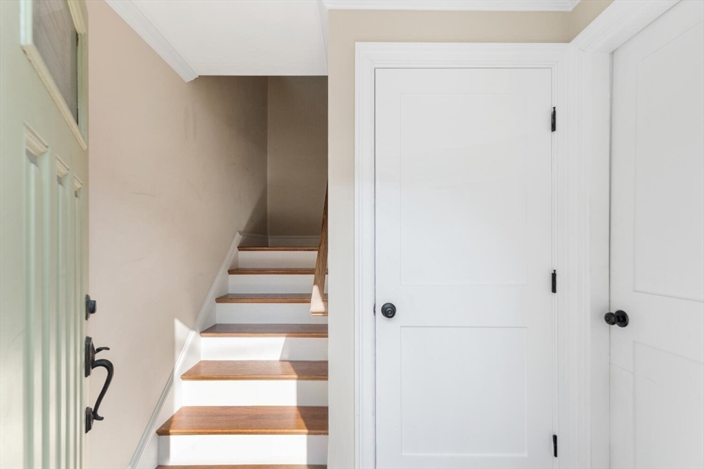 23 Locust Street, Unit 2 Danvers, MA 01923 - Photo 29 of 32 a view of staircase with white walls and a window