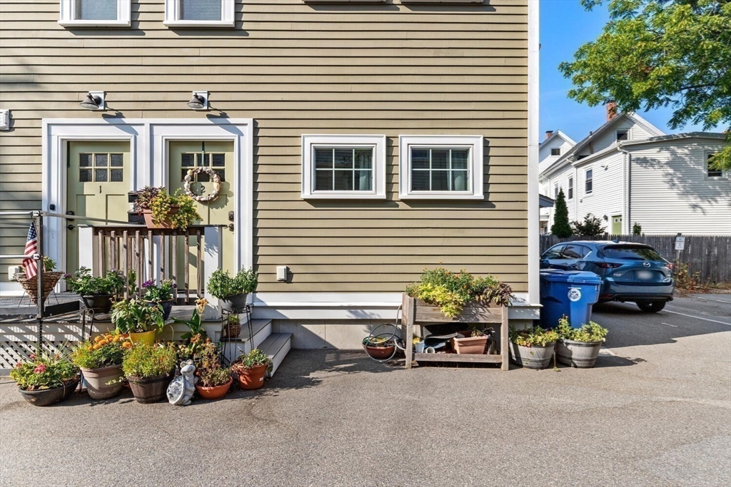 23 Locust Street, Unit 2 Danvers, MA 01923 - Photo 31 of 32 a view of a car in front of a house