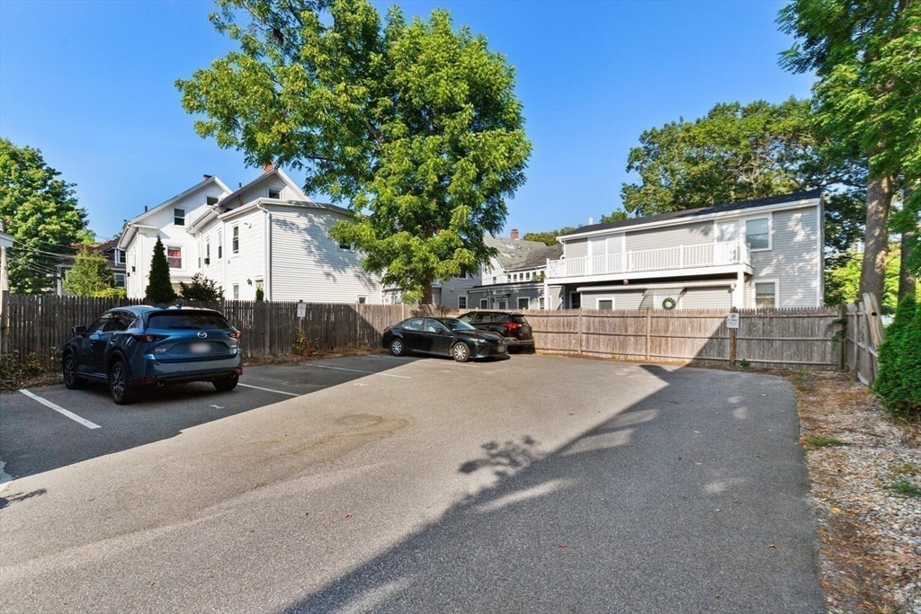 23 Locust Street, Unit 2 Danvers, MA 01923 - Photo 32 of 32 a car parked in front of a house