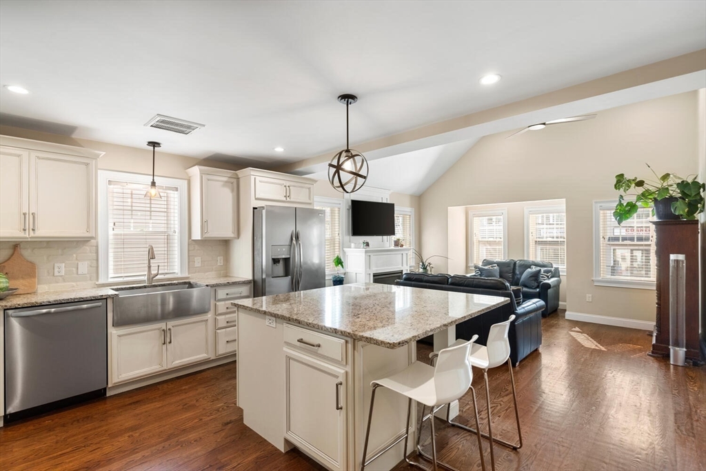 23 Locust Street, Unit 2 Danvers, MA 01923 - Photo 6 of 32 a kitchen with center island and sink
