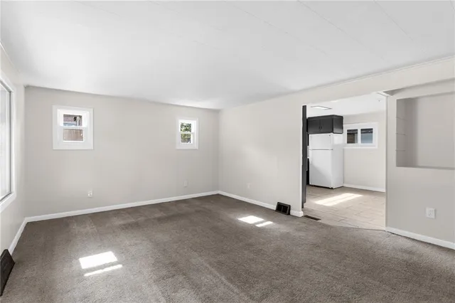 a kitchen with a sink stove and refrigerator