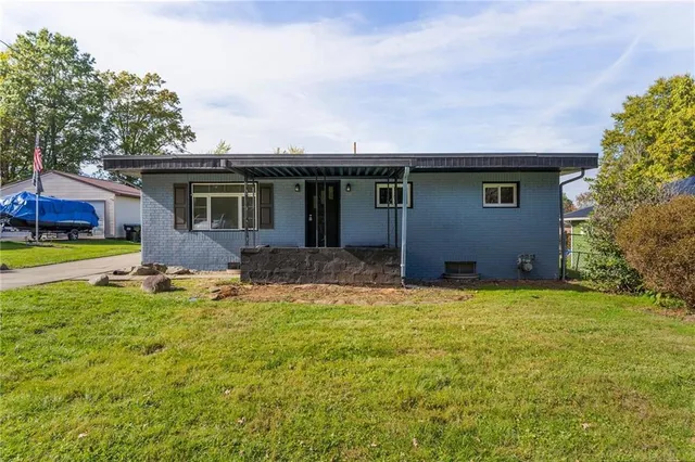 front view of a house with a yard