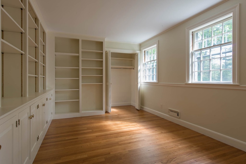 32 Bay State Road Weston, MA 02493 - Photo 21 of 30 a view of an empty room with a window