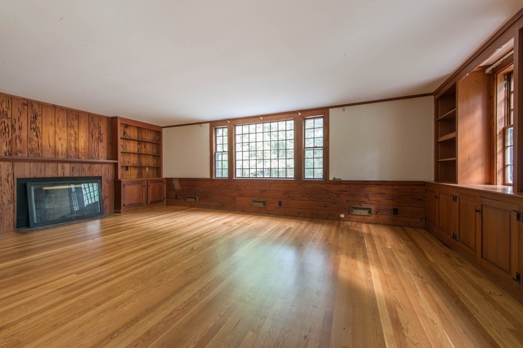 32 Bay State Road Weston, MA 02493 - Photo 23 of 30 a view of an empty room with wooden floor and a window