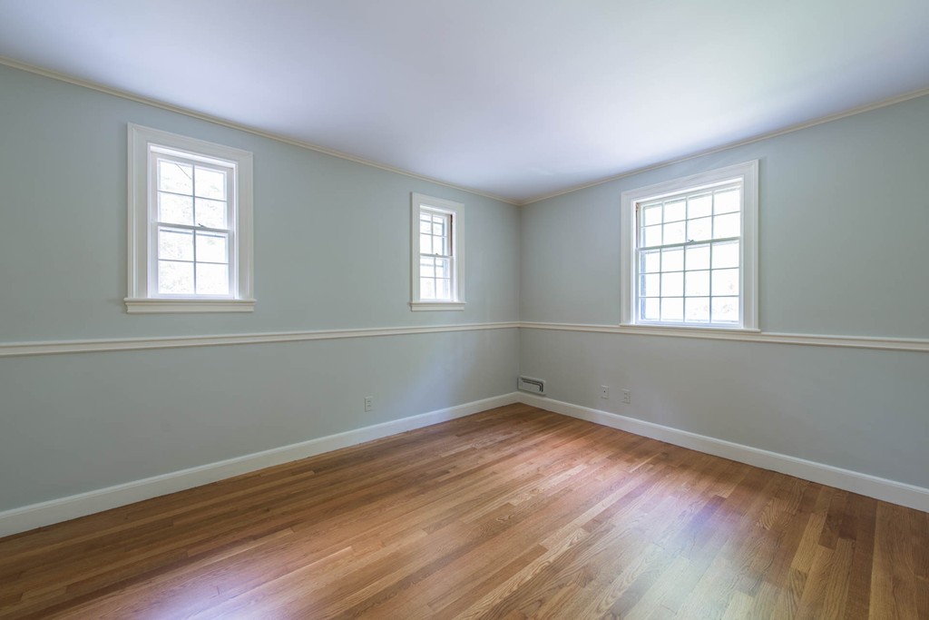 32 Bay State Road Weston, MA 02493 - Photo 29 of 30 an empty room with wooden floor and windows