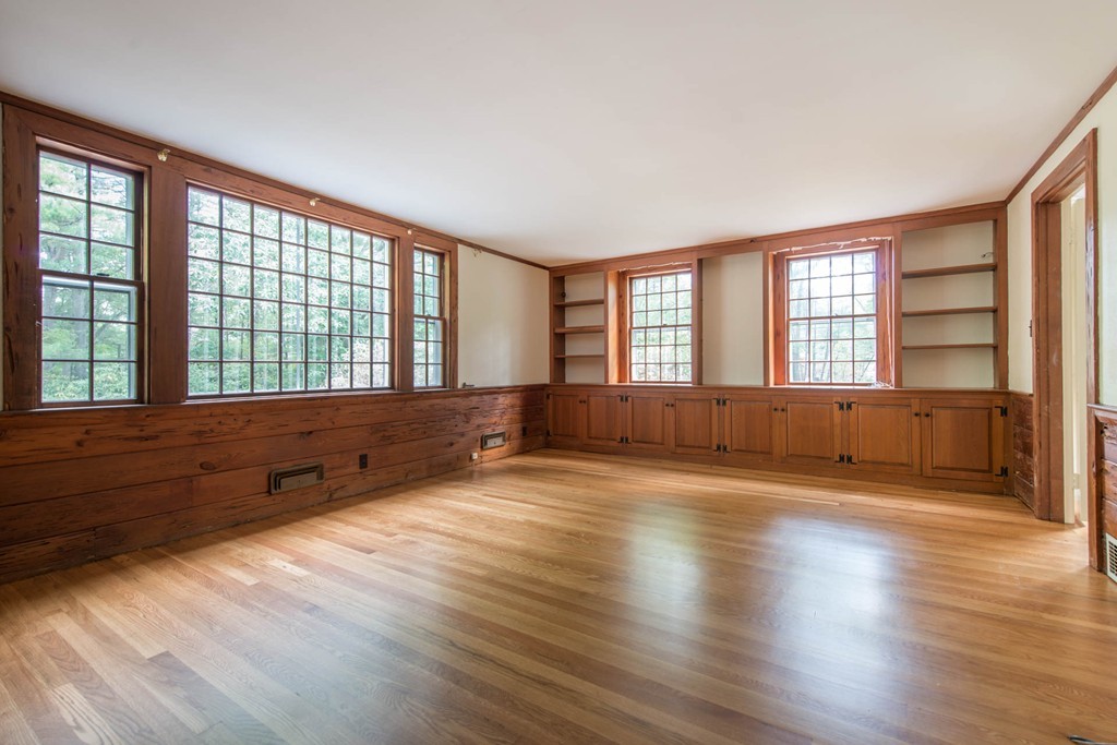32 Bay State Road Weston, MA 02493 - Photo 9 of 30 wooden floor in an empty room with a window