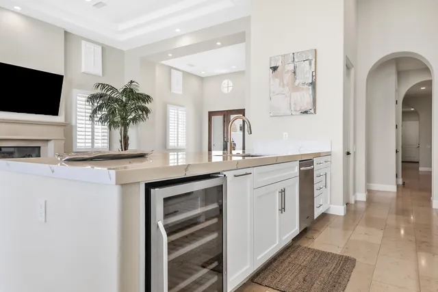 a spacious bathroom with a granite countertop sink and a mirror