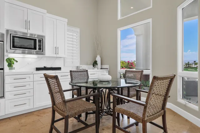 a dining room with furniture and wooden floor