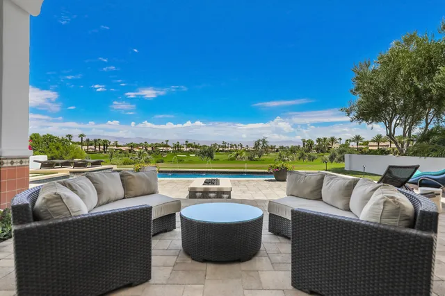 a view of roof deck with seating space and barbeque oven