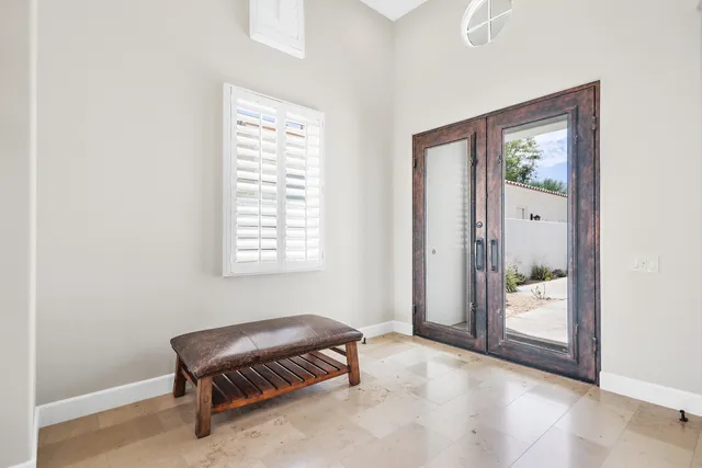 a room that has a window and a chair in it