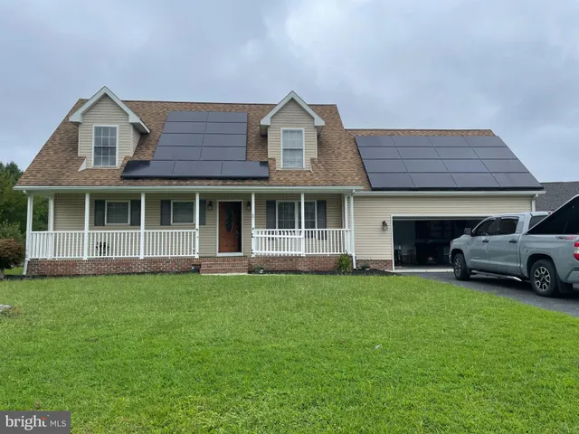 a view of a yard in front of a house