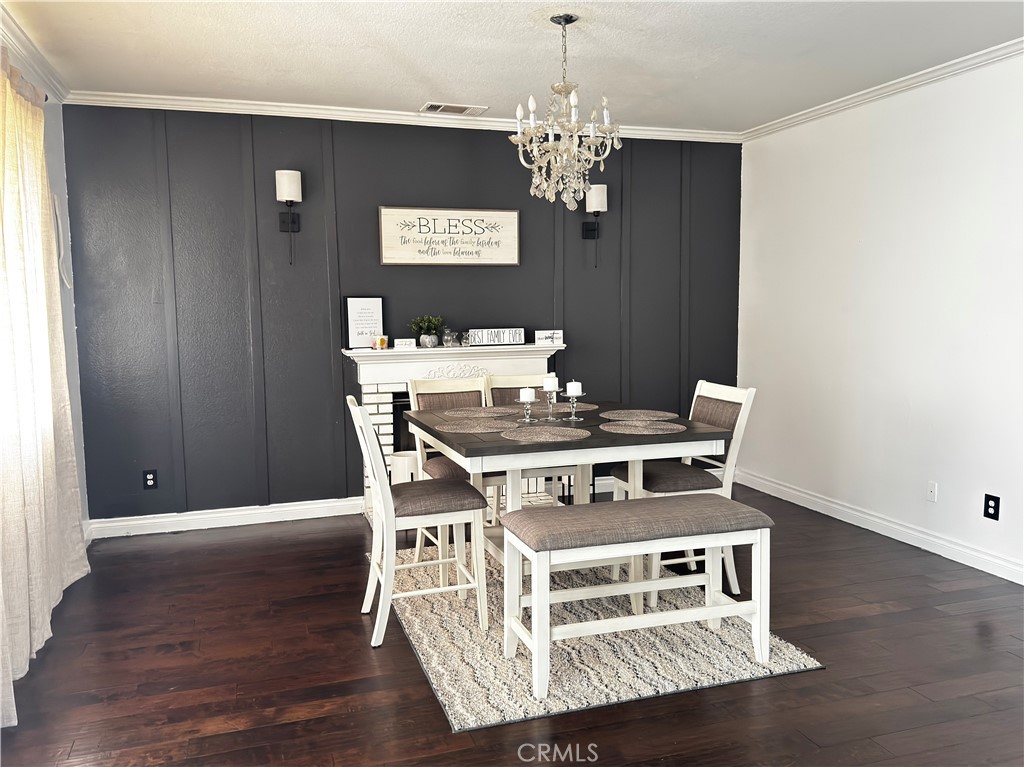 3807 Seattle Street Hemet, CA 92545 - Photo 11 of 37 a view of a dining room with wooden floor
