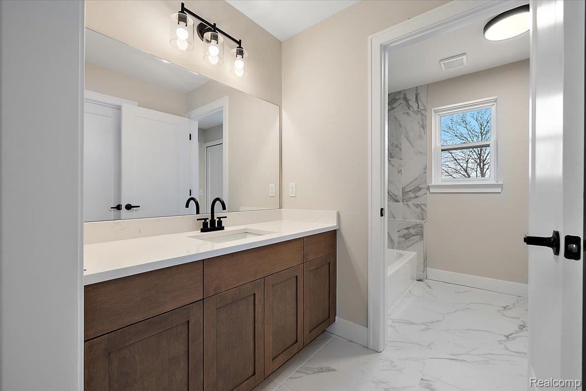 53650 Romeo Plank Road Macomb, MI 48042 - Photo 43 of 64 Full bath with vanity, and bathing tub / shower combination