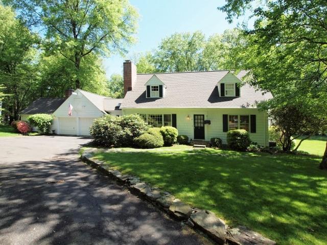 94 Compo Road North Westport, CT 06880 - Photo 1 of 1 a front view of a house with a yard and trees