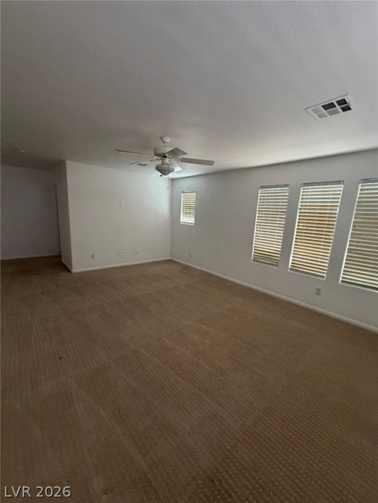 3862 Landing Ridge Place Las Vegas, NV 89135 - Photo 9 of 26 A spacious room offers ample natural illumination, creating an inviting atmosphere.