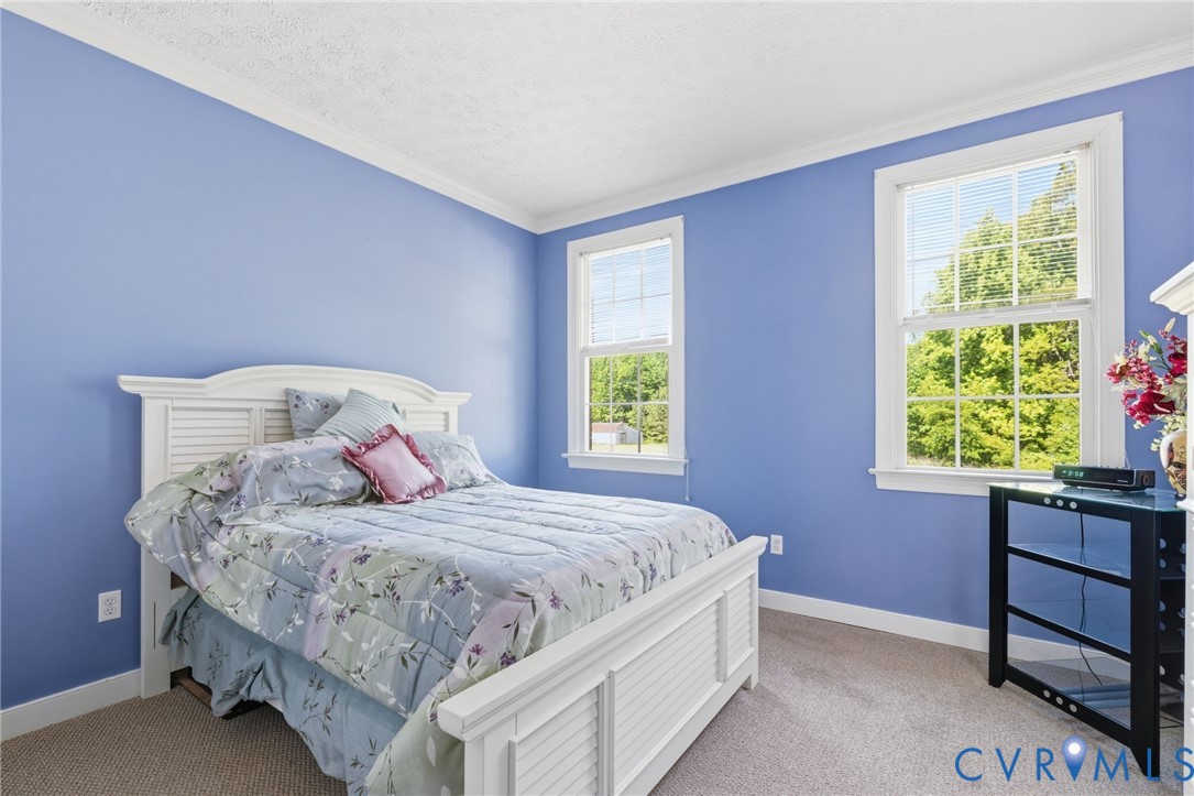 15441 Goshen Road Montpelier, VA 23192 - Photo 30 of 47 a bedroom with a bed and a window