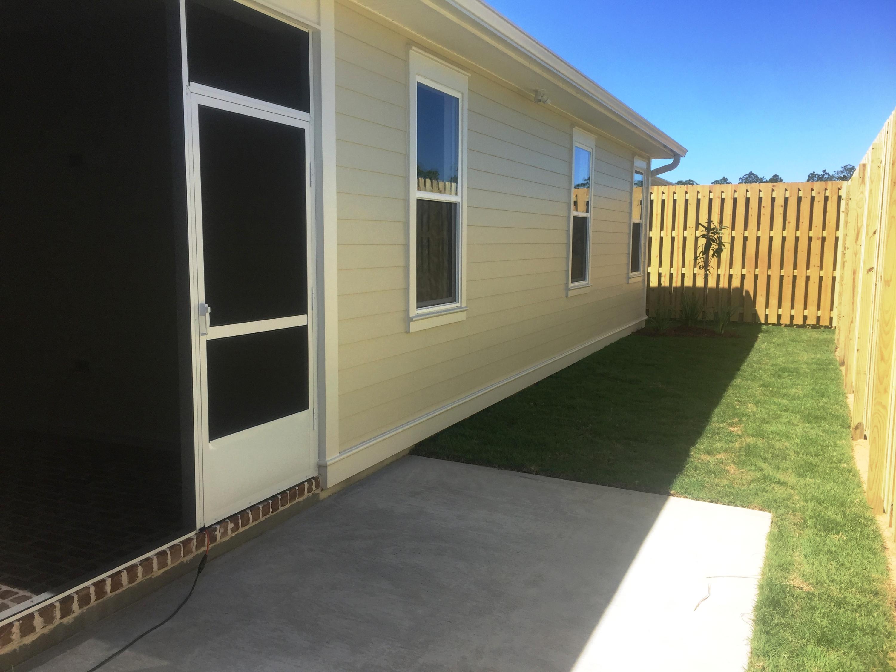 167 North Zander Way Santa Rosa Beach, FL 32459 - Photo 2 of 30 a backyard of a house
