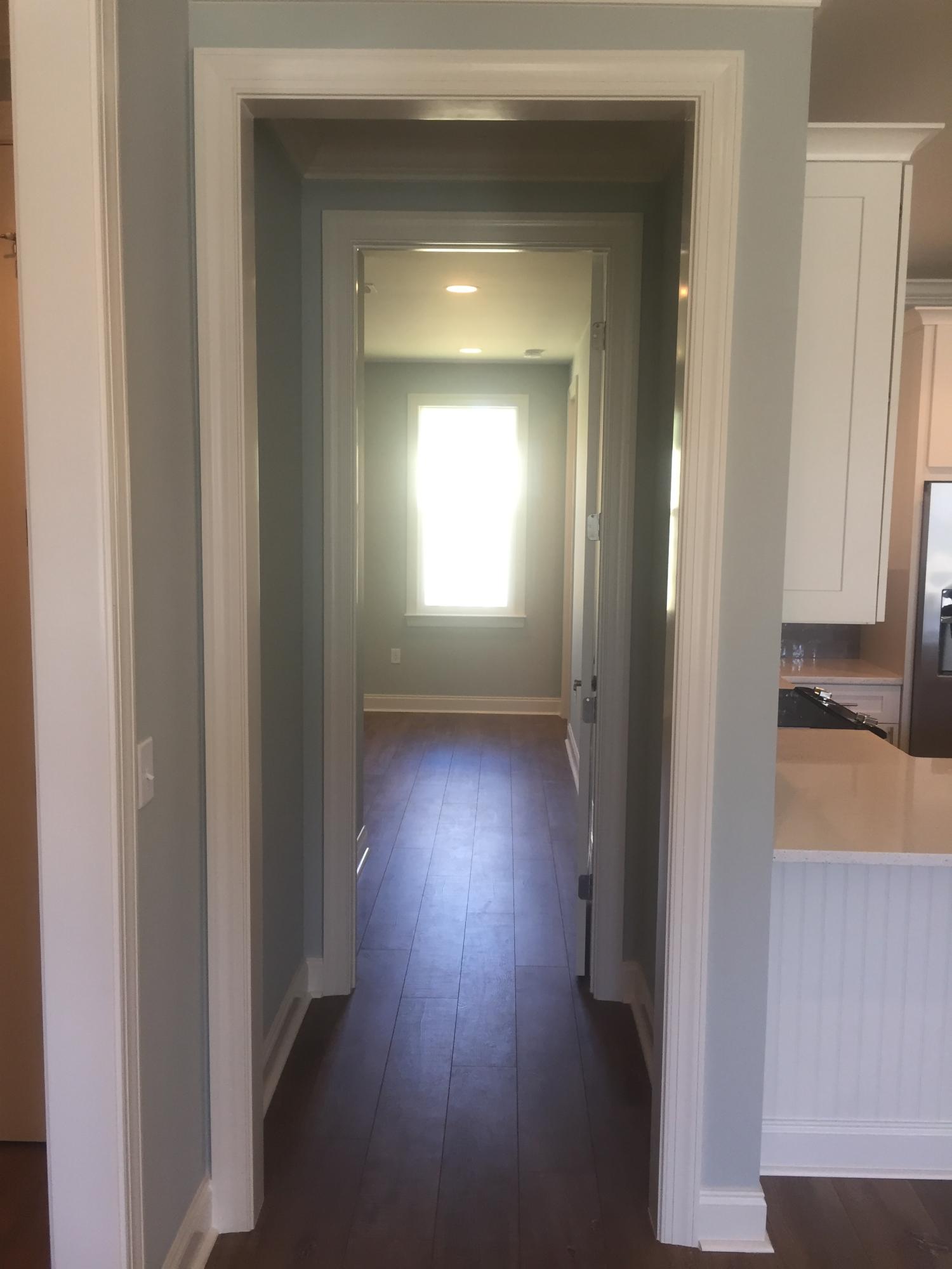 167 North Zander Way Santa Rosa Beach, FL 32459 - Photo 15 of 30 a view of a hallway with wooden floor and a cabinet