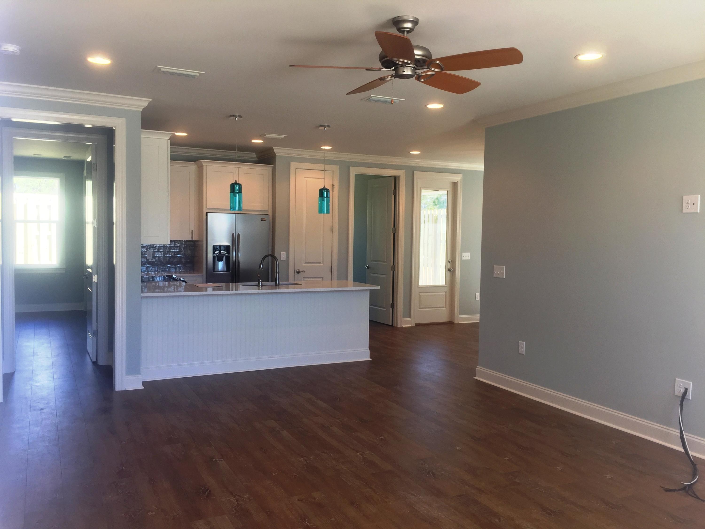 167 North Zander Way Santa Rosa Beach, FL 32459 - Photo 26 of 30 an empty room with wooden floor and a ceiling fan
