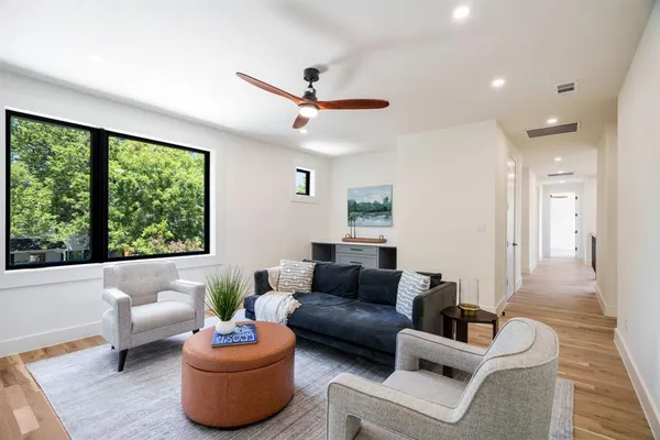 a living room with furniture and a large window