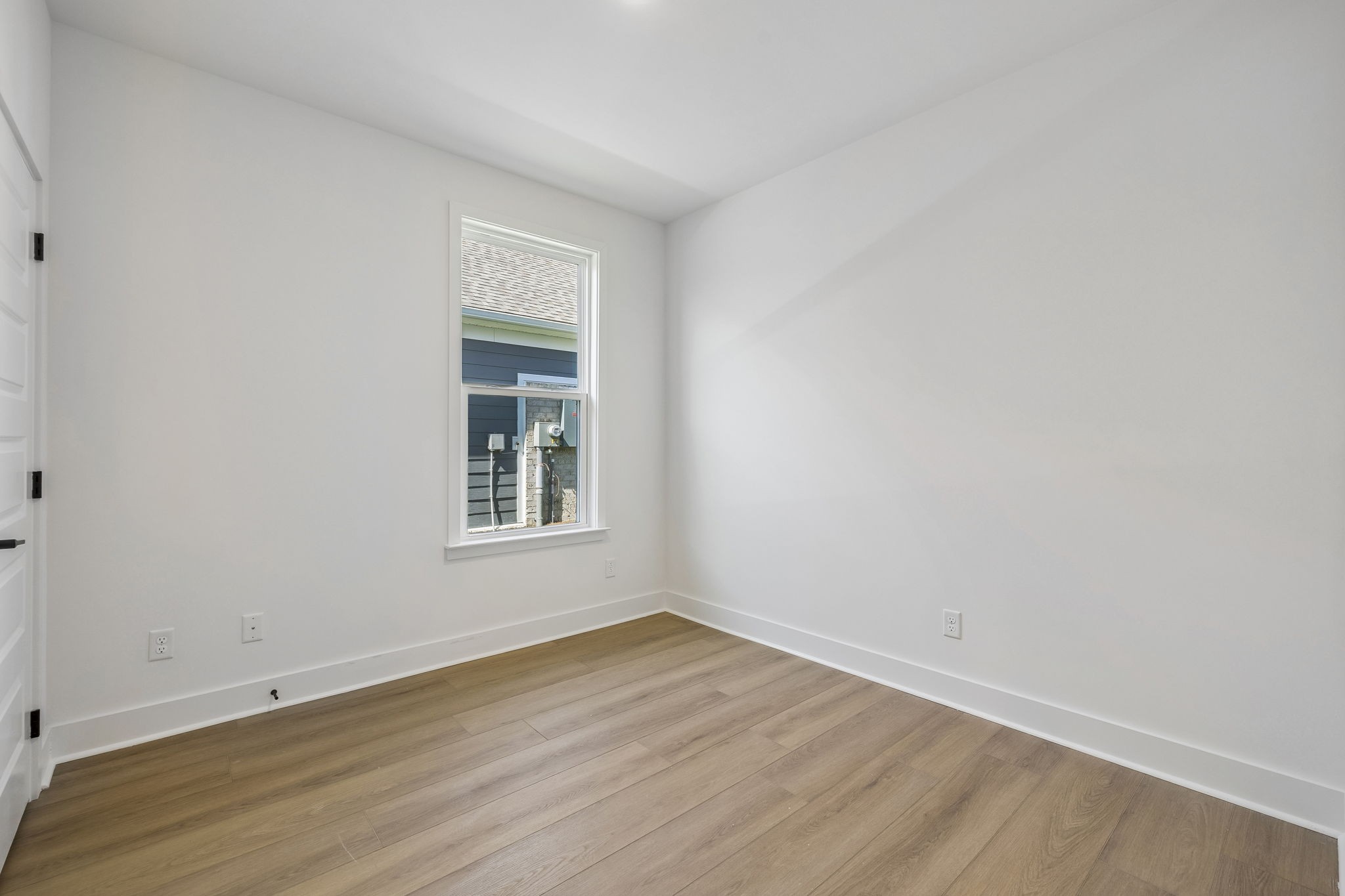 519 Scarlet Oak Road Lebanon, TN 37090 - Photo 20 of 51 a view of an empty room with wooden floor and a window