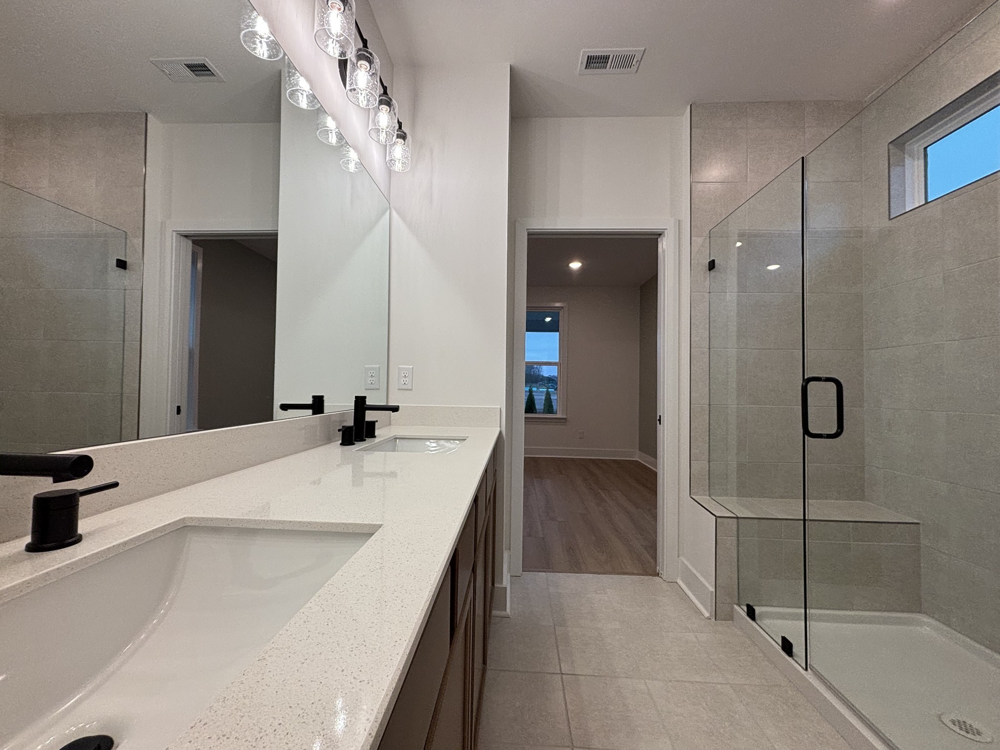 519 Scarlet Oak Road Lebanon, TN 37090 - Photo 27 of 51 a bathroom with a tub sink and mirror