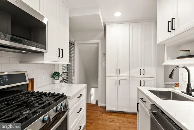 a view of a workspace with furniture and window