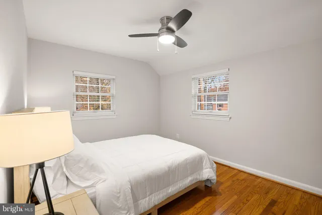 a bedroom with a bed window and wall painting