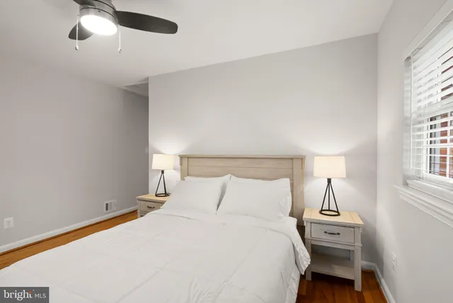 a bathroom with a sink vanity mirror and a bathtub