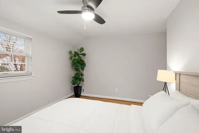 a bathroom with a sink vanity mirror and tub