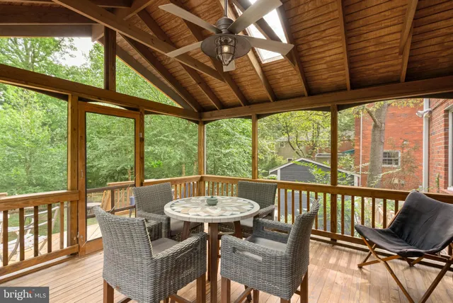 a view of a balcony with furniture