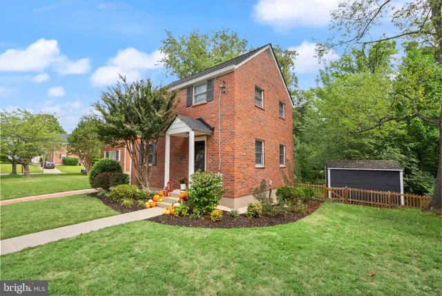 a living room with furniture a rug and a window