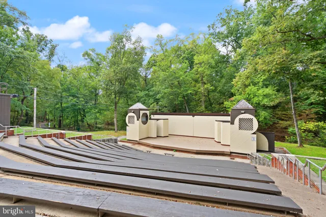 a front view of a building with outdoor seating