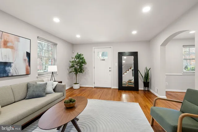 a living room with furniture and a rug