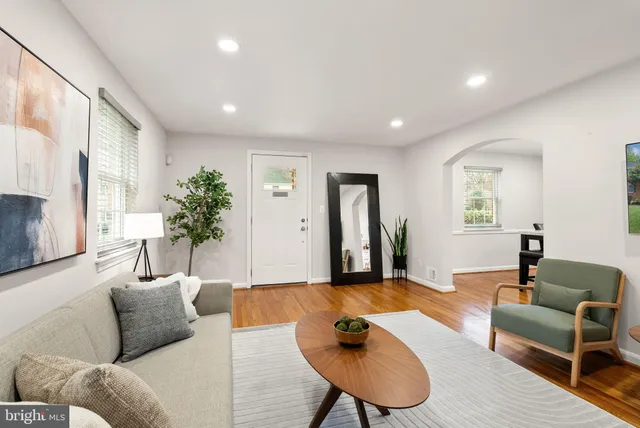 a kitchen with stainless steel appliances a sink a stove and a refrigerator