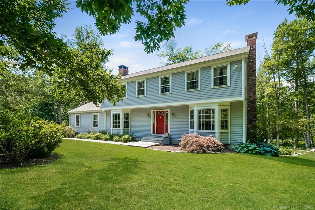 32 Osborn Farm Road Weston, CT 06883 - Photo 1 of 1 a front view of a house with garden