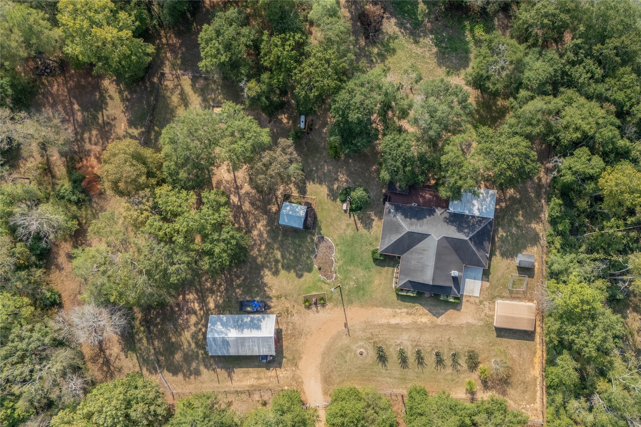 an aerial view of residential house with outdoor space