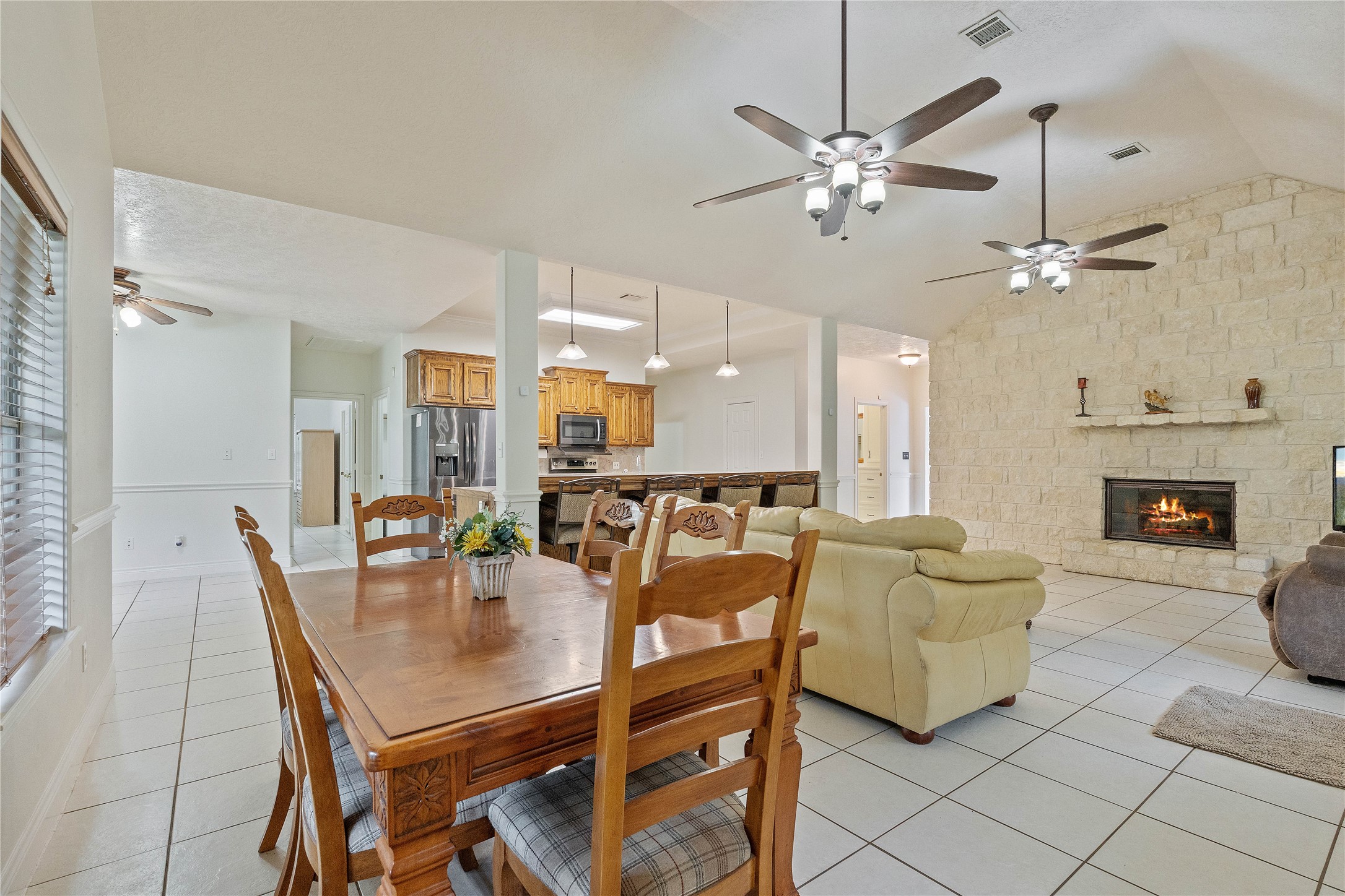 600 Hughes Loop Willis, TX 77378 - Photo 11 of 50 a dining room with furniture and a chandelier