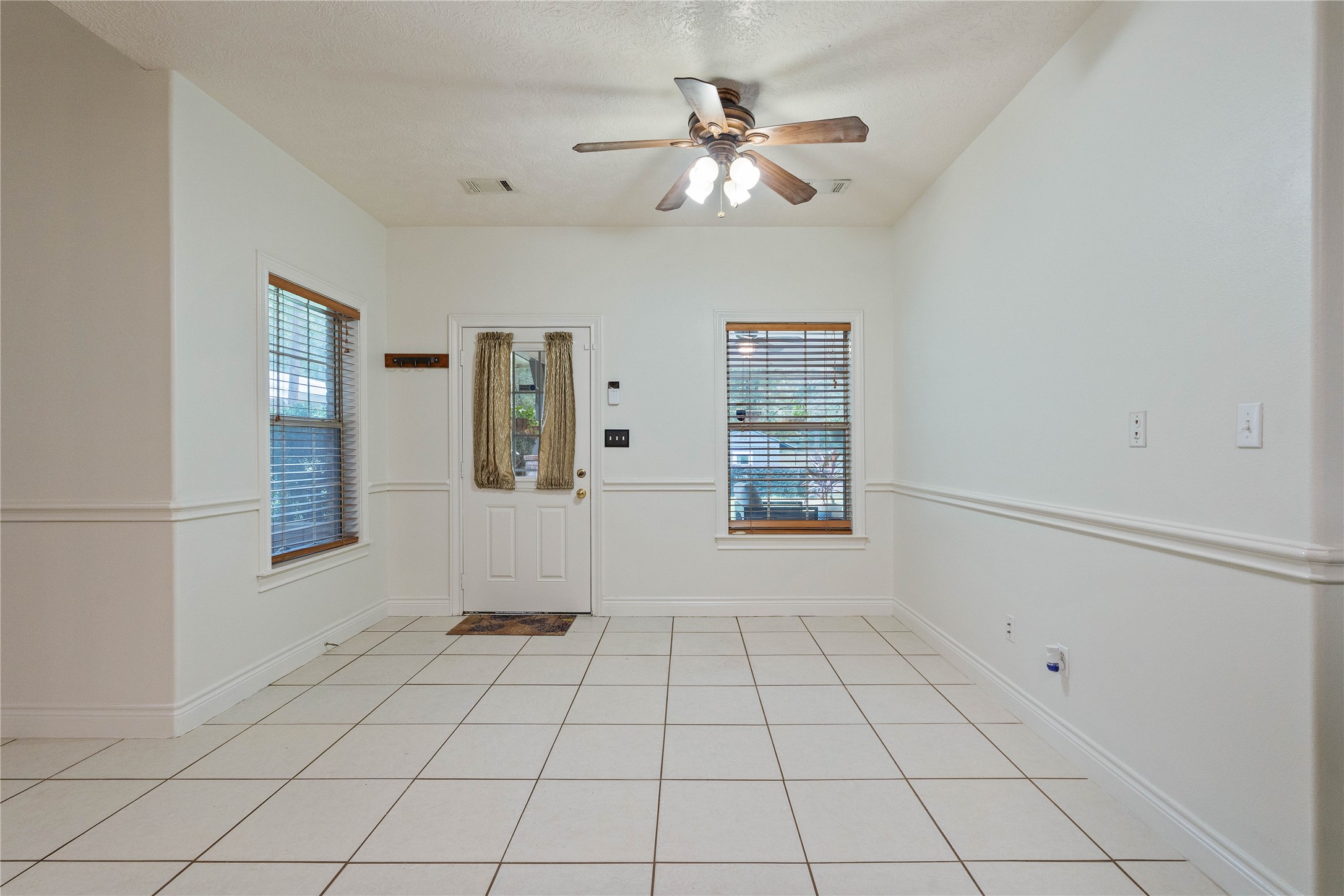 600 Hughes Loop Willis, TX 77378 - Photo 17 of 50 a view of an empty room with chandelier fan