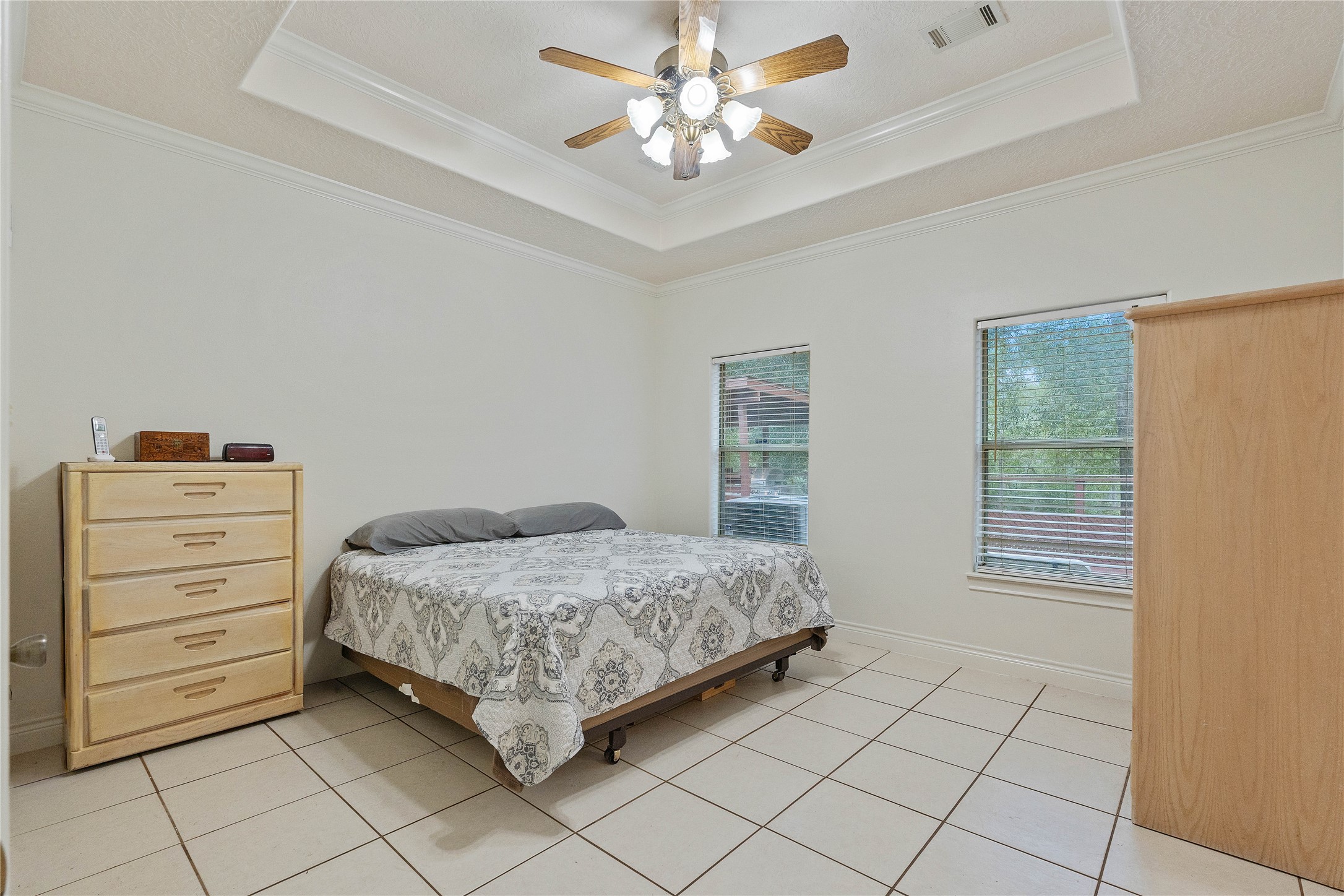 600 Hughes Loop Willis, TX 77378 - Photo 18 of 50 a bedroom with a bed and a cabinets