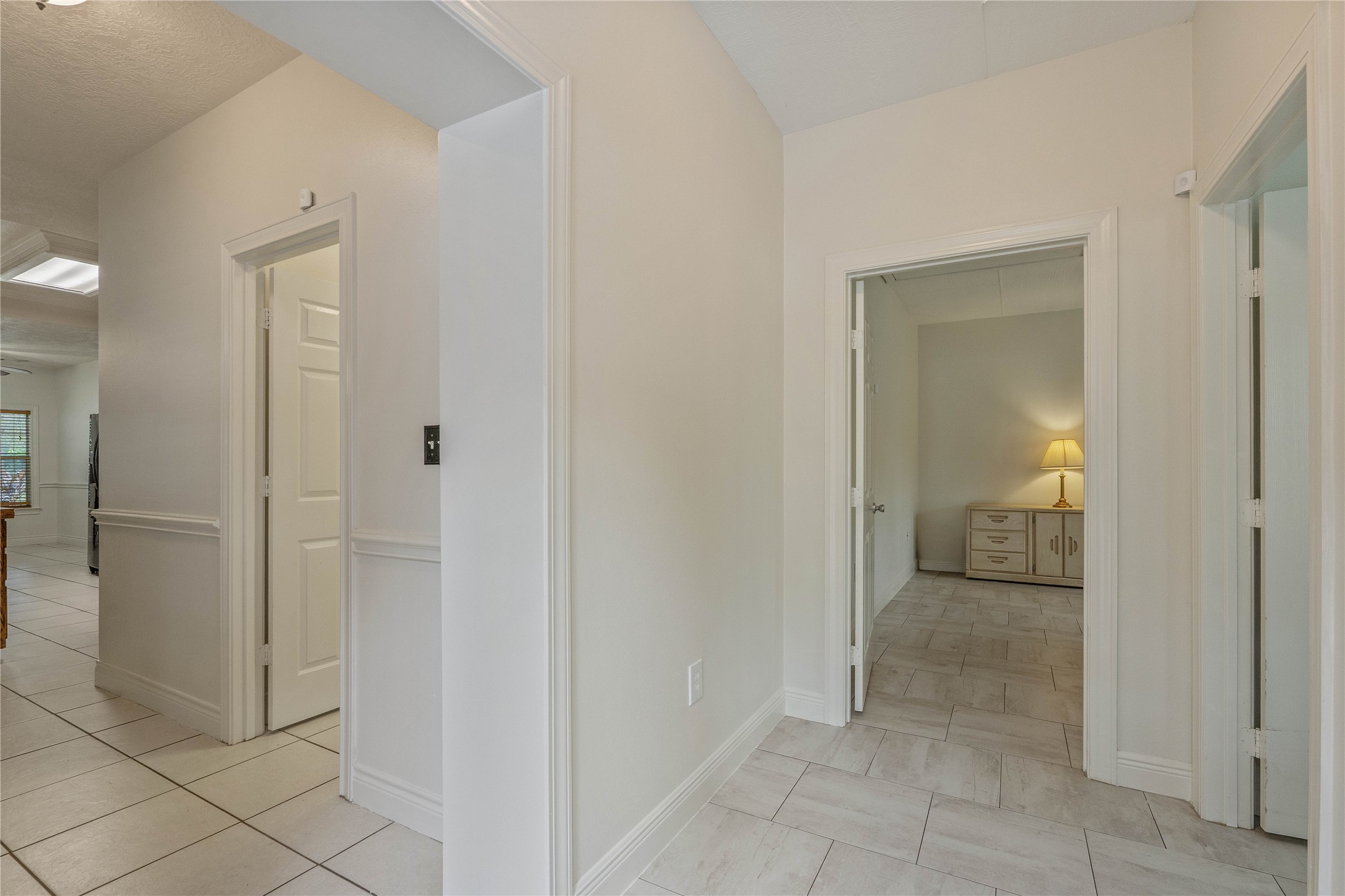 600 Hughes Loop Willis, TX 77378 - Photo 25 of 50 a view of a hallway with wooden cabinets