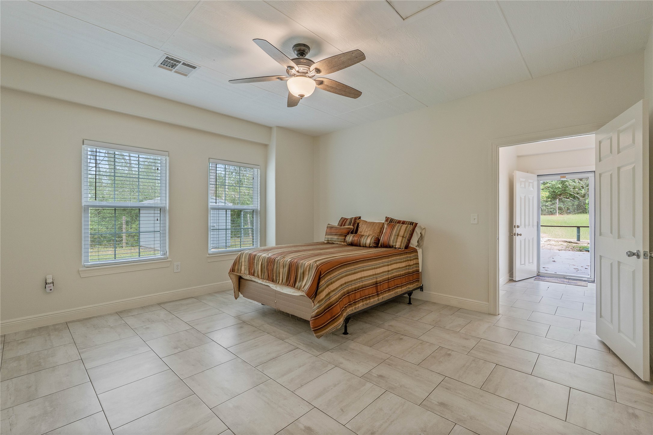 600 Hughes Loop Willis, TX 77378 - Photo 26 of 50 a spacious bedroom with a bed and window